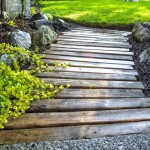 Cool DIY Garden Path Ideas pallet wood garden walkway.jpg
