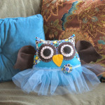 Stuffed owl pillow with a blue tutu