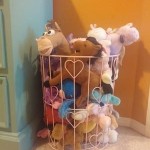 use a wire basket to storage stuffed animals