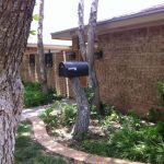 Tree stump mailbox