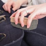 Use a pumice stone or lint roller to de-fuzz a sweater