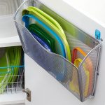 A wall file mounted to a cabinet door is an easy solution for separating plastic lids from bases