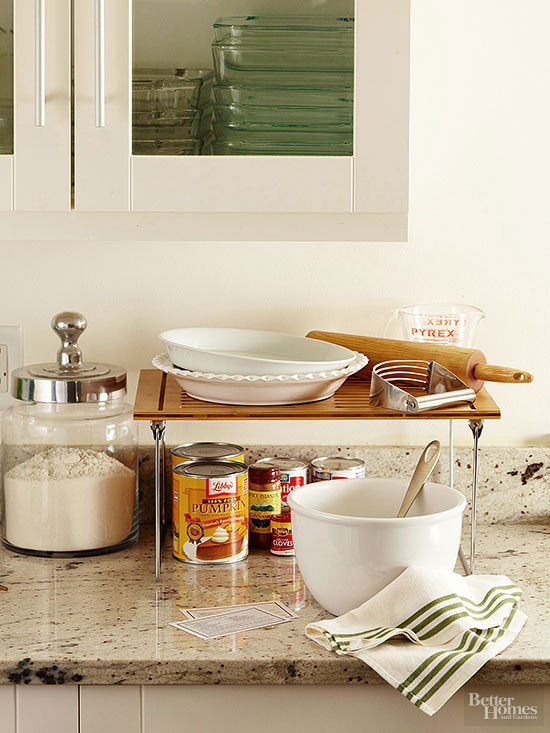 Prepare your workstation by arranging ingredients in the created space underneath, and set dishes and utensils on top
