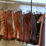 Use clothing hangers to organize your boots